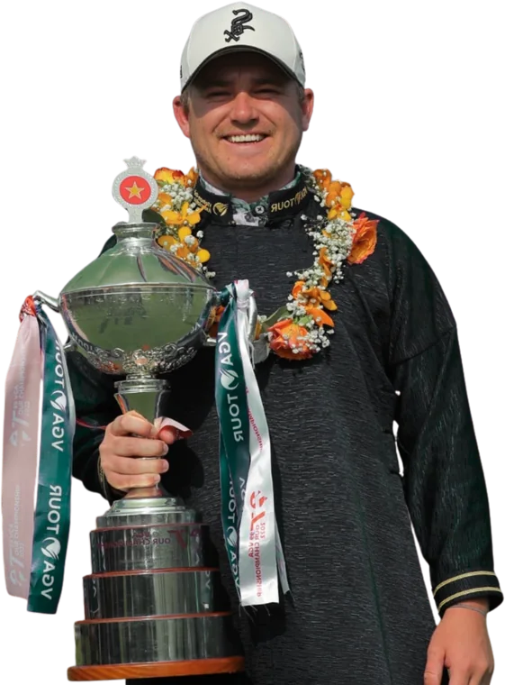 Joel Troy holding a Vietnam Tour trophy